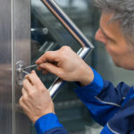 Mature Male Lockpicker Fixing Door Handle At Home